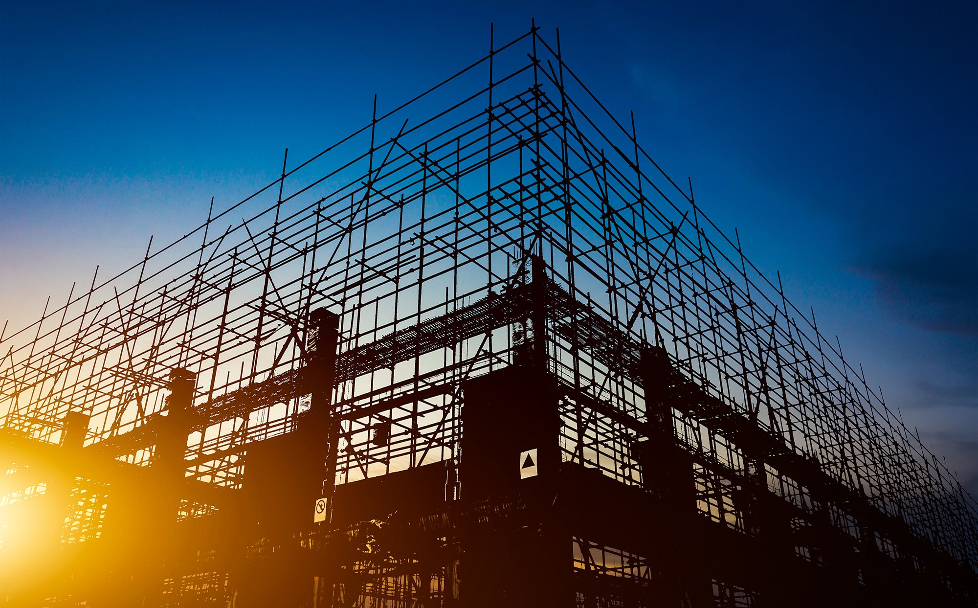 Backlit half built building silhouette